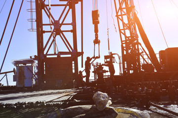 field oil workers at work