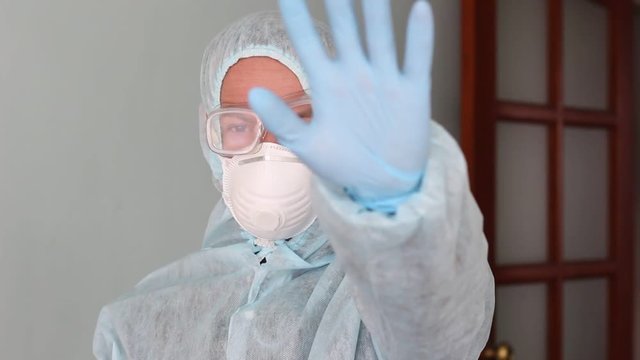 Hazard sign. Man in the personal protective equipment