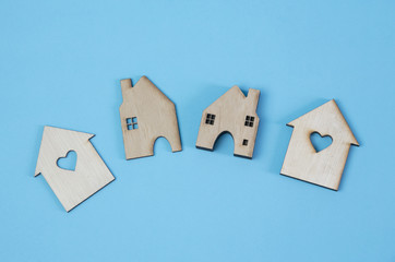 Wooden homes model,for love and family concept,isolated on light blue background