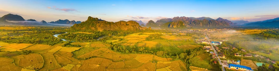 Fotobehang Aerial view of the fields, river and mountain. Beautiful landscape panorama. Laos. © Olga Khoroshunova