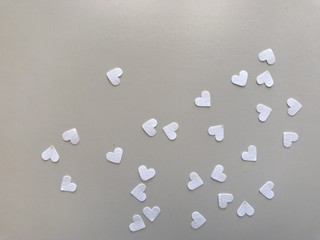 heart shape white papers on light gray leather, using for background, 