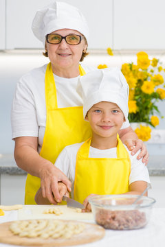 portrait of grandmother and grandson in the kitchen