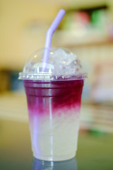 Butterfly pea with lemon and soda on the table and blurred background