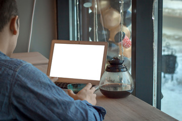 Man with coffee and white laptop