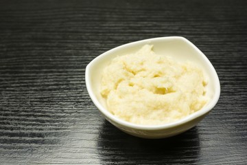 Grated horseradish in a bowl.