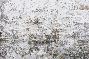 Wall fragment with scratches and cracks