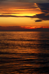 Colorful sunset over the Baltic Sea shore and beach in Rowy, Poland