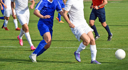 Naklejka premium Soccer match outdoor in summer time
