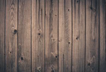Wooden retro background of old  vertical boards with knots.