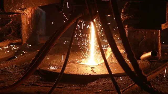 molten steel casting and rolled steel production at metallurgical works
