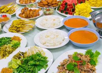 Food Variety Table top Fried chicken Fried fish roasted pork papaya salad roasted duck and fruit Orange watermelon