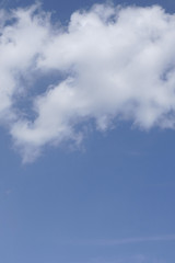 Blue sky with clouds and sun brown .