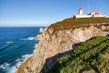 Fototapeta na wymiar Beautiful ocean landscape, rocks and waves. Cape Roca, Portugal, The westernmost point of Europe and a popular destination for travel