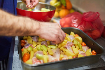 Hands of a mature man cooking
