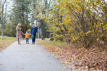 Fototapeta premium autumn forest walk with the son family