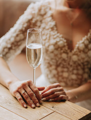 the bride with a glass of champagne