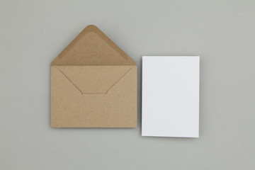Blank white card with kraft brown paper envelope template mock up