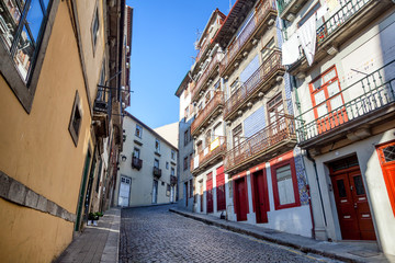 Fototapeta na wymiar Beautiful cityscape, street in the historic center of Porto, Portugal, old town. A popular destination for traveling in Europe
