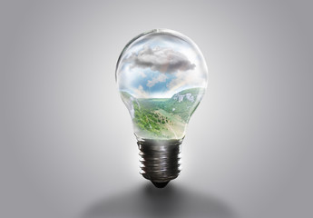 the landscape in the light bulb isolate on white gray background