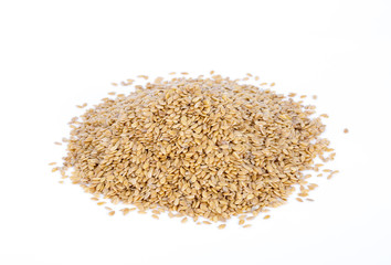 Golden flax seeds on a white background