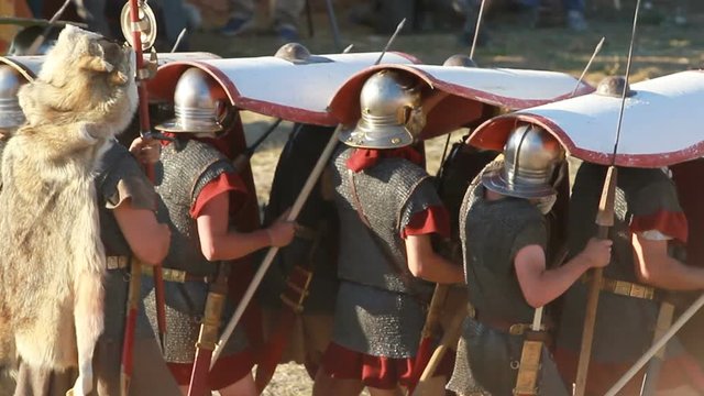 the line of knights with shields goes on the offensive