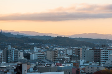 Kyoto city view with mountain range on the background.