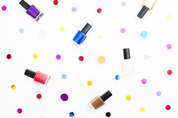 Obraz premium Beauty composition with bright nail polish on white background. Flat lay, top view. Beauty concept for woman