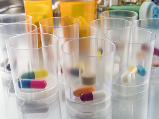 Daily medication at a hospital table, conceptual image