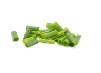 Closeup Chopped fresh green leaf onions isolated on white background .