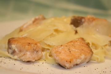 appetizing pieces of fish with noodles