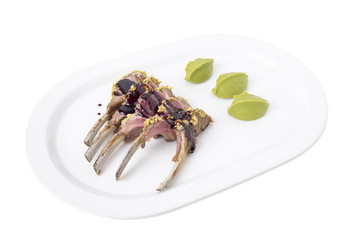 Roasted rack of lamb with pistachios.