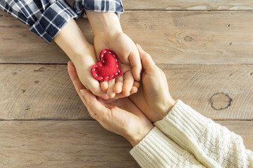 Red heart in hands