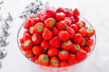 Strawberry in the plate on the table