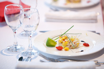 Served table in the restaurant with glasses, napkins and cutlery
