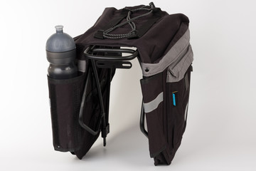 Bike carrier bag on rear rack , in pocket is water bottle, studio photo, isolated on white...