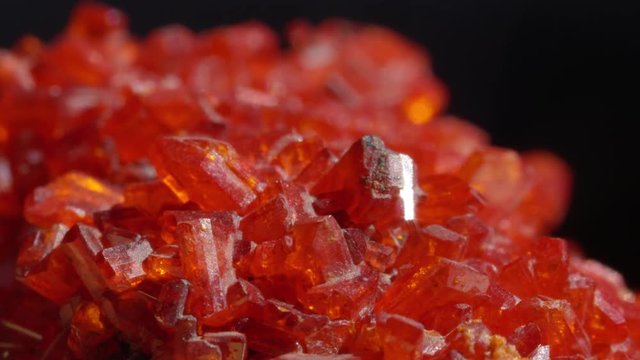 MACRO CLOSE UP Stunning crimson Ruby sparkling under light. Expensive blood-red coloured precious stone glistening like a diamond. One of the traditional cardinal gems before processing for jewellery