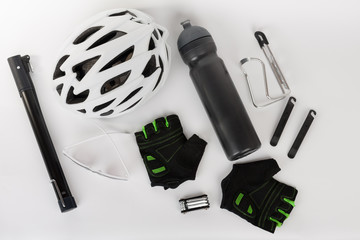 Obraz premium Bike accessories, bike helmet, bike gloves, eyeglasses and water bottle in holder