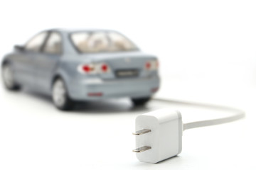 electric car with plug and wire on white background