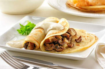 Mushroom pancakes with sauce
