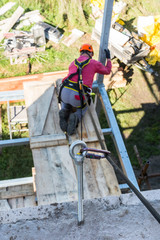 Fototapeta premium Height works on construction. Close-up of anchor eye. Occupational safety. Protection of a worker while working on building a loggia.