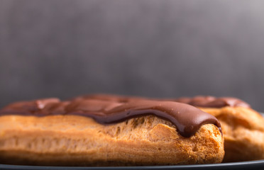 Homemade eclair on a stone table