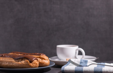 Homemade eclair on a stone table