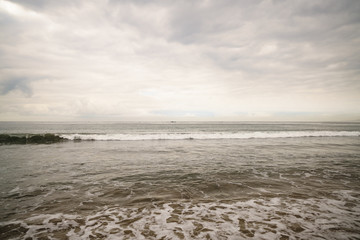 ocean waves on Santa Monica beach in cloudy november day