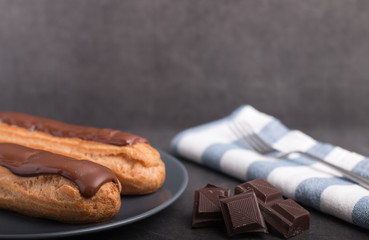 Homemade eclair on a stone table