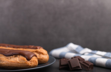 Homemade eclair on a stone table