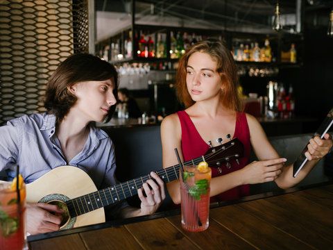 Online Music Teaching Lessons. Young People Learn How To Play Instruments Through The Internet. Limitless Possibilities For Education Thanks To Modern Technologies Concept