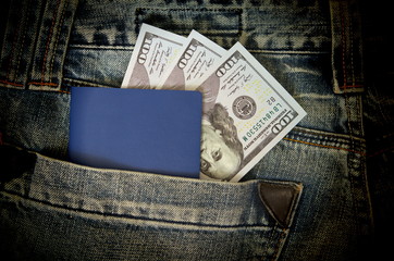 Passport and dollars stick out pocket