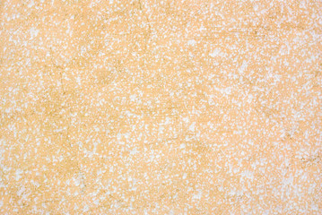 Orange and white stucco grungy wall texture	
