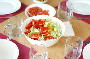 The process of preparing a festive dinner: dishes, serving, sandwiches, salads.