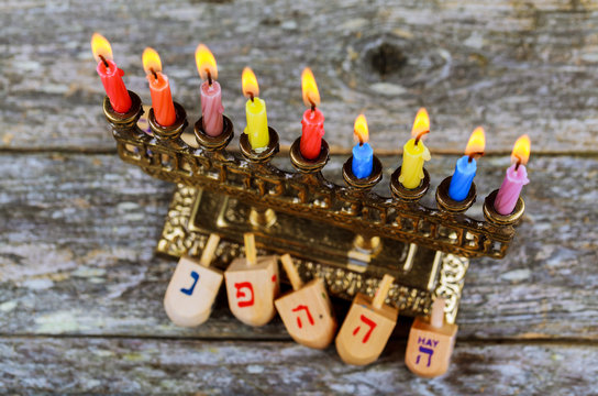 Hanukkah Chanukah Jewish holiday background with Hanukah Chanukkah menorah Judaism candelabra burning candles and traditional